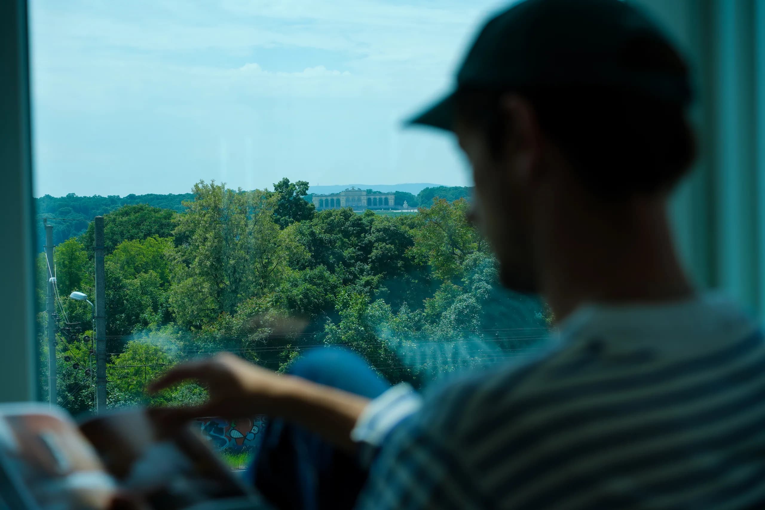 Person looking out over Vienna from a room